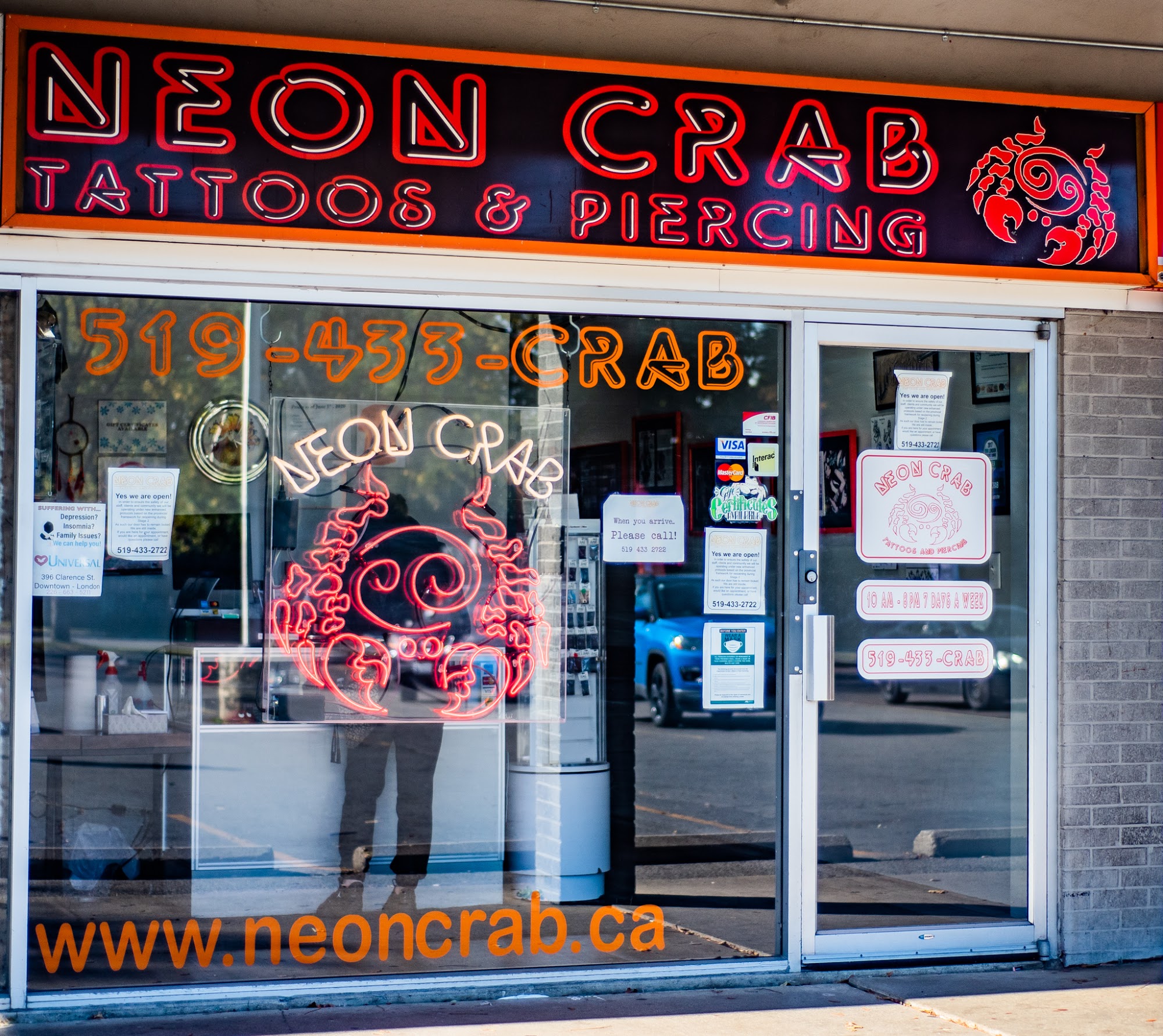 Neon Crab Tattoos & Piercing